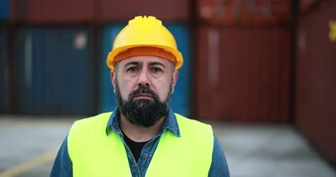 Man looking on camera working at freight terminal port Stock Footage 179973116