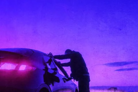 A man looking into a car window on a summers evening. With a neon vaporwave Stock Photos