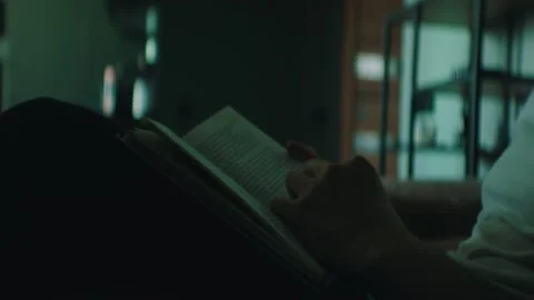 A man is looking for the chapter in a book Stock Footage 131398738