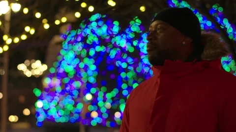 Man looking at christmas lights Stock Footage 145436451