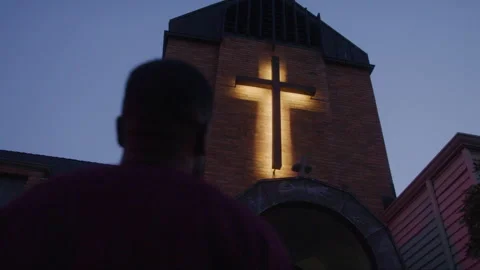 Man Looking Up At Church Cross Stock Footage 217769306