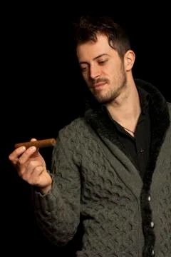 Man looking at a cigar Stock Photos