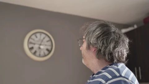 Man Looking at The Clock Afraid of Getting Late Stock Footage 236641298