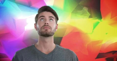Man looking up with colorful polygons background 스톡 사진