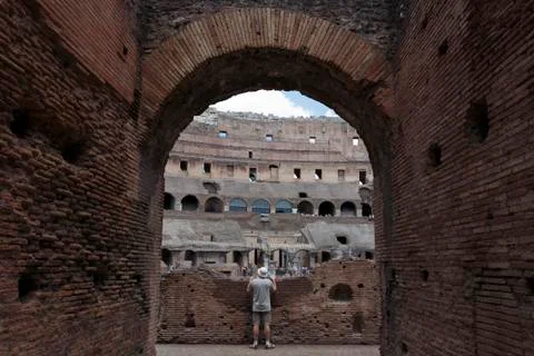 Man looking into the Colosseum Stock Photos