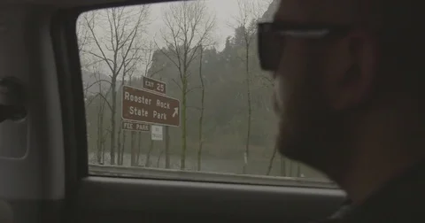 Man looking at Columbia river and Canadian Rockies while travelling in the car Stock Footage 69740454