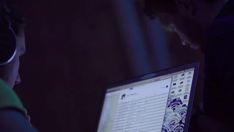 A man looking in computer and listening music Stock Footage 83655243