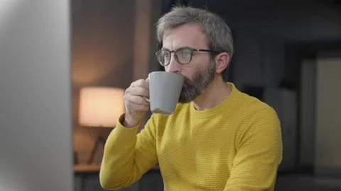 Man looking at computer, listening to conference, work lesson, taking notes and Stock Footage 173374061