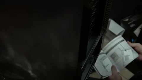 Man looking at computer manual Stock Footage 88009445