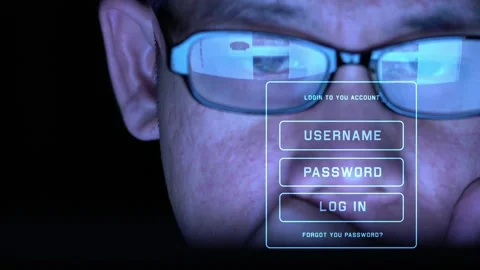 A man is looking at a computer screen with a blue tint Stock Footage 314899496