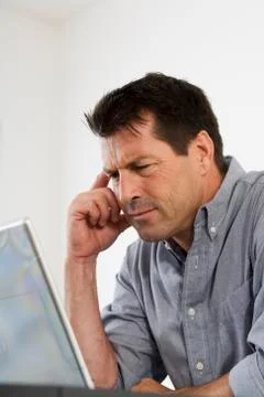 Man Looking at Computer Screen Stock Photos