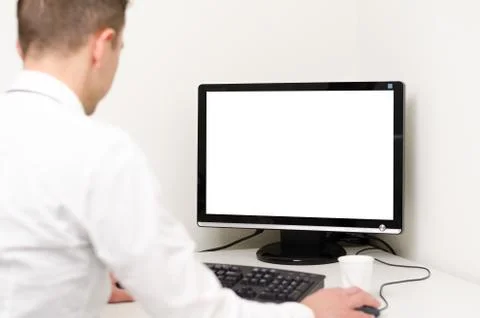 Man looking at computer with white screen Stock-Fotos
