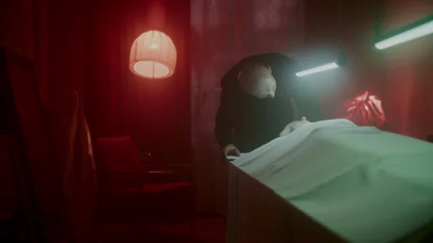 A man looking at the corpse on the table under the light Stock-Footage 259851390