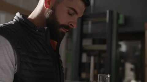 A man looking at a cup Stock Footage 137679262