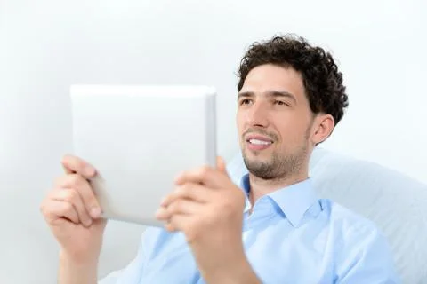 Man looking on digital tablet Stock Photos