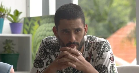 Man looking disappointed while watching TV at home, slow motion Stock Footage 87465693