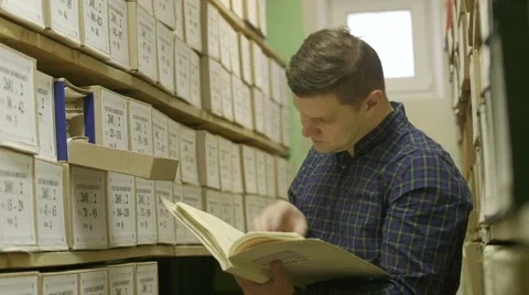 Man looking documents in the archive Stock Footage 59665130