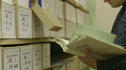 Man looking documents in the archive Stock Footage 59665176