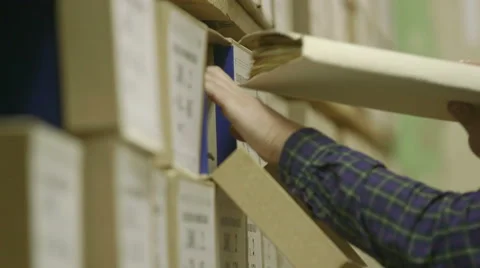 Man looking documents in the archive Stock Footage 59665266