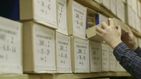 Man looking documents in the archive Stock Footage 59665378