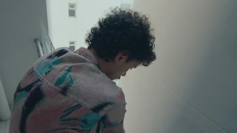 Man Looking Down from the Balcony Stock Footage 235660243