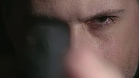 Man Looking Down Gun Barrel Rack Focus Close Up Stock Footage 73267544