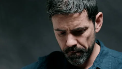 Man looking down playing guitar Video stock 130790152