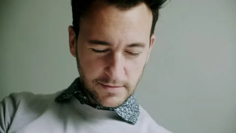 Man looking down smiling Stock Footage 130639374