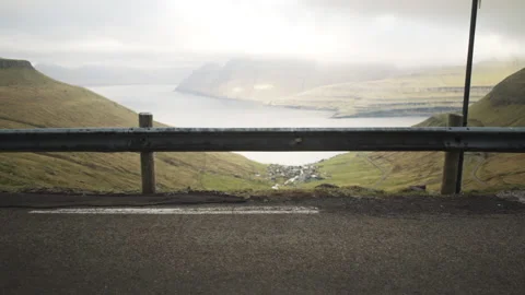 Man Looking Down Towards Funningur Video stock 133576383