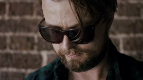 Man Looking Down When Assembling A Skateboard Stock Footage 133622566