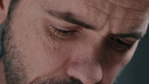 Man looking down while playing guitar Video stock 130792275