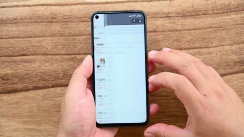 Man looking for drinks on Luckin Coffees online shopping web Stock Footage 249602102