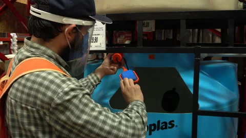 A man looking at the electronic water level sensor of a home cistern tank.  Video stock 140324108
