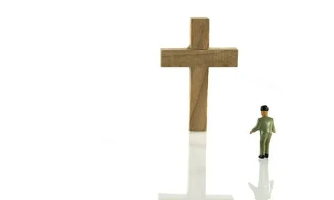 Man looking at empty cross man looking at empty wooden cross isolated on w... Stock Photos