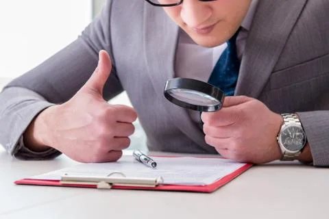 Man looking for errors and mistakes in report 스톡 사진