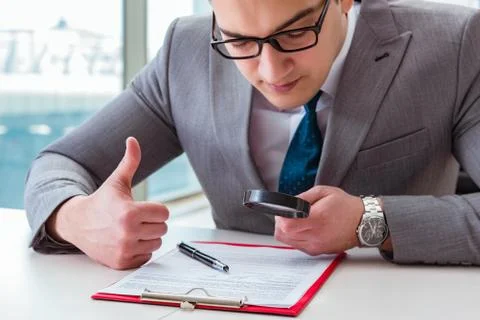 Man looking for errors and mistakes in report 스톡 사진