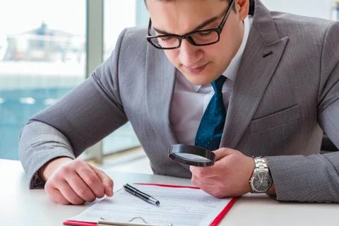 Man looking for errors and mistakes in report 스톡 사진