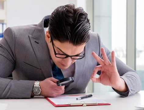 Man looking for errors and mistakes in report 스톡 사진