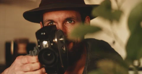 Man looking excited to capture view with vintage camera Stock Footage 203578354