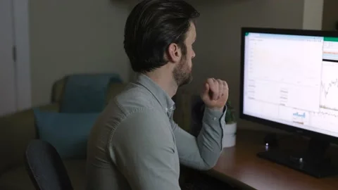 Man looking at finance chart on computer. 4K 24FPS Stock Footage 152889427