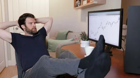 Man looking at finance chart on computer, day trader, investing from home Stock Footage 153497892
