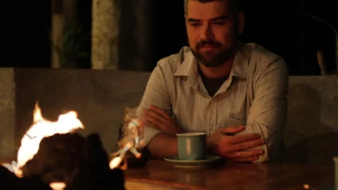 Man looking at fire in restaurant. Video stock 273478679
