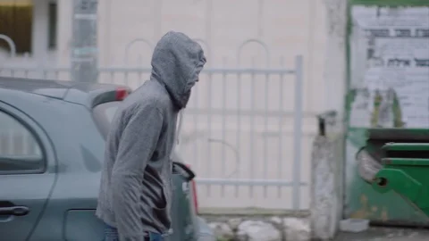 Man looking for food in the garbage Stock Footage 104556721