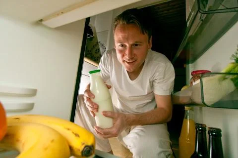 Man Looking Into The Fridge Stock Photos