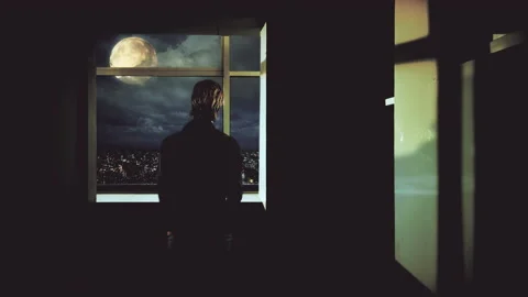 Man Looking Full Moon Over City Buildings From Inside Apartment, Zoom In Video stock 165124016
