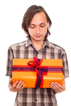 Man looking at gift Stock Photos