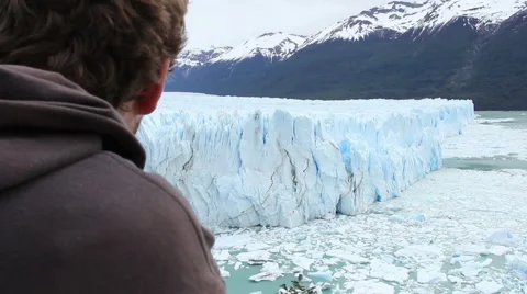 Man Looking at Glacier Stock Footage 46628860