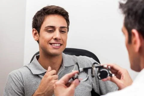 Man looking at the glasses 写真素材