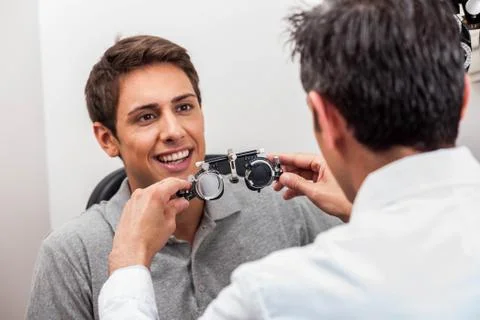 Man looking at the glasses Stock Photos