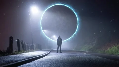 A man looking at a glowing science fiction portal. On a foggy winters night Stock Footage 145947151